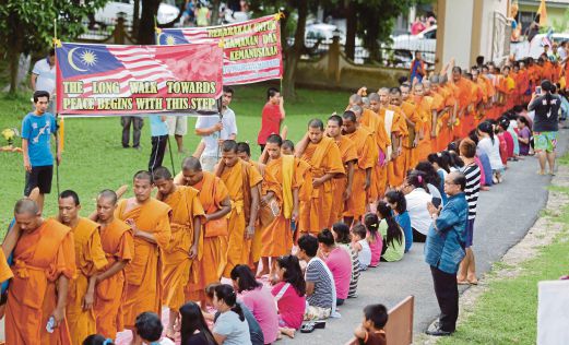 Monks take part in 9km peace walk